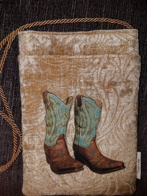 Large teal and brown boots on tan